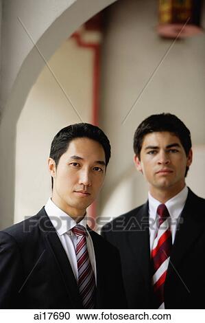 Businessmen looking at camera View Large Photo Image Stock Image - Businessmen looking at camera . Fotosearch