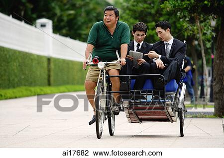Businessmen riding in trishaw View Large Photo Image Stock Image - Businessmen riding in trishaw. Fotosearch