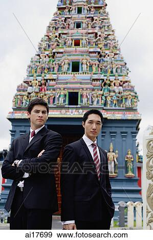Businessmen standing in front of Hindu temple View Large Photo Image Stock Photo - Businessmen standing in front of Hindu temple . Fotosearch