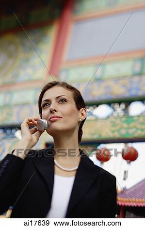 Businesswoman using mobile phone View Large Photo Image Stock Photo - Businesswoman using mobile phone . Fotosearch