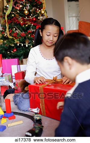 Children opening Christmas presents View Large Photo Image Stock Photo - Children opening Christmas presents. Fotosearch