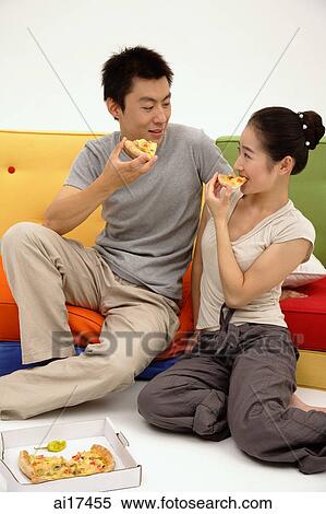 Couple eating pizza View Large Photo Image Stock Photography - Couple eating pizza . Fotosearch
