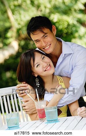 Couple embracing, both smiling at camera, portrait View Large Photo Image Stock Photography - Couple embracing, both smiling at camera, portrait. Fotosearch