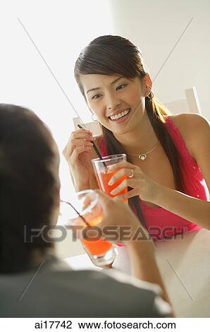 Couple having drinks View Large Photo Image Stock Image - Couple having drinks . Fotosearch
