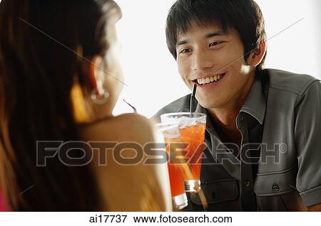 Couple having drinks View Large Photo Image Stock Photo - Couple having drinks . Fotosearch