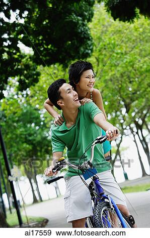 Couple on tandem bicycle View Large Photo Image Stock Photo - Couple on tandem bicycle. Fotosearch