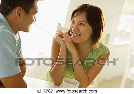 Couple sitting at cafe View Large Photo Image Stock Photo - Couple sitting at cafe . Fotosearch