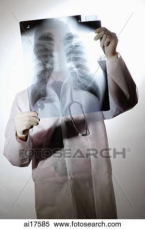 Doctor holding X-Ray View Large Photo Image Stock Photography - Doctor holding X-Ray . Fotosearch
