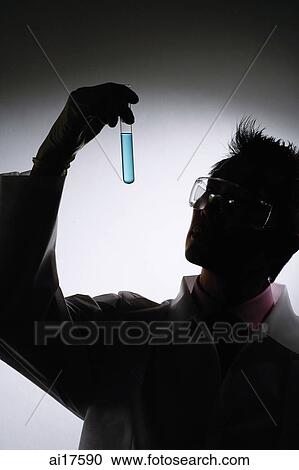 Doctor looking at test tube, silhouette View Large Photo Image Stock Image - Doctor looking at test tube, silhouette . Fotosearch