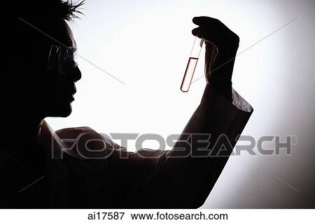 Doctor looking at test tube, silhouette View Large Photo Image Stock Photo - Doctor looking at test tube, silhouette . Fotosearch