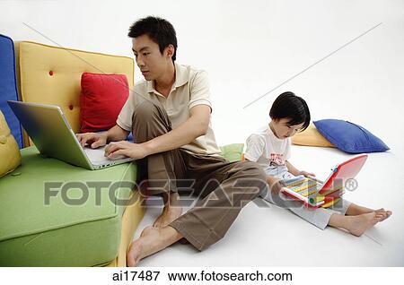 Father and daughter using individual laptops View Large Photo Image Stock Photo - Father and daughter using individual laptops . Fotosearch