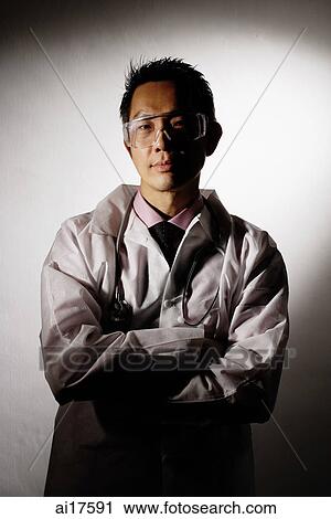 Healthcare professional in lab coat and protective eyewear View Large Photo Image Stock Image - Healthcare professional in lab coat and protective eyewear. Fotosearch