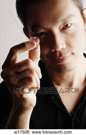 Man holding one dice View Large Photo Image Stock Photograph - Man holding one dice . Fotosearch