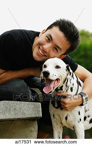 Man hugging Dalmatian View Large Photo Image Stock Image - Man hugging Dalmatian . Fotosearch