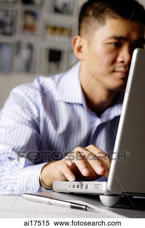 Man using laptop View Large Photo Image Stock Photography - Man using laptop . Fotosearch
