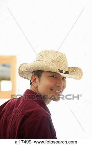 Man wearing hat, smiling at camera View Large Photo Image Stock Photo - Man wearing hat, smiling at camera . Fotosearch