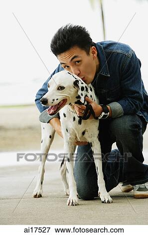 Man with Dalmatian dog, smiling at camera View Large Photo Image Stock Photo - Man with Dalmatian dog, smiling at camera . Fotosearch
