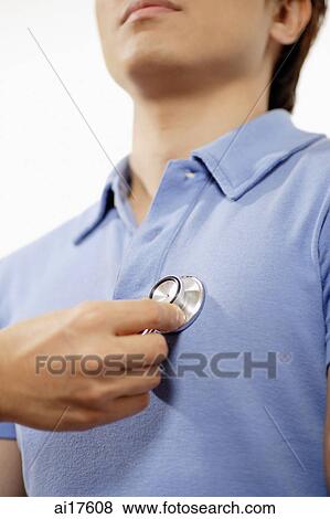 Man with stethoscope on chest View Large Photo Image Stock Photo - Man with stethoscope on chest . Fotosearch