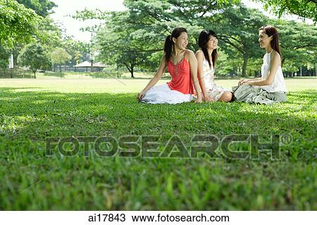 Three young women in park View Large Photo Image Stock Image - Three young women in park. Fotosearch