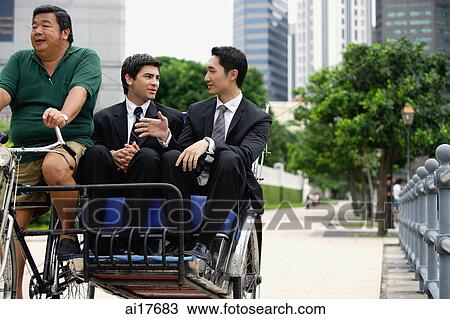 Two businessmen riding in trishaw View Large Photo Image Stock Image - Two businessmen riding in trishaw . Fotosearch