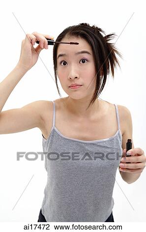 Woman applying mascara View Large Photo Image Stock Image - Woman applying mascara . Fotosearch