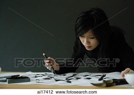 Woman painting Chinese calligraphy View Large Photo Image Stock Image - Woman painting Chinese calligraphy . Fotosearch