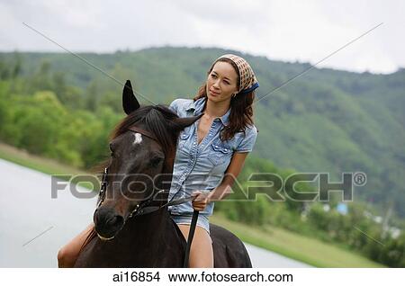Picture - Woman riding horse . Fotosearch