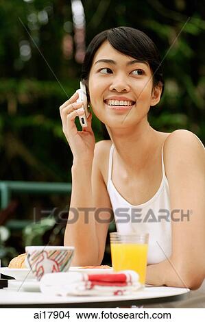 Woman using mobile phone View Large Photo Image Picture - Woman using mobile phone . Fotosearch