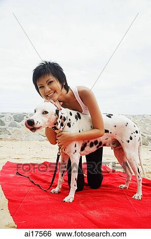 Woman with Dalmatian on beach View Large Photo Image Stock Photograph - Woman with Dalmatian on beach . Fotosearch