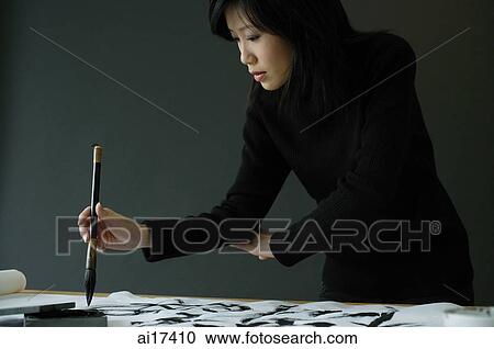 Young woman painting Chinese calligraphy View Large Photo Image Stock Image - Young woman painting Chinese calligraphy . Fotosearch