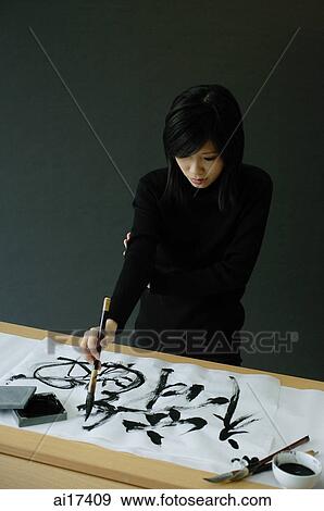 Young woman painting Chinese calligraphy View Large Photo Image Stock Photo - Young woman painting Chinese calligraphy . Fotosearch