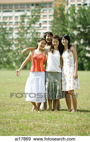 Young women smiling at camera View Large Photo Image Stock Photo - Young women smiling at camera . Fotosearch