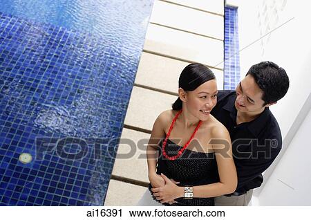 Couple embracing, high angle view View Large Photo Image Stock Image - Couple embracing, high angle view . Fotosearch