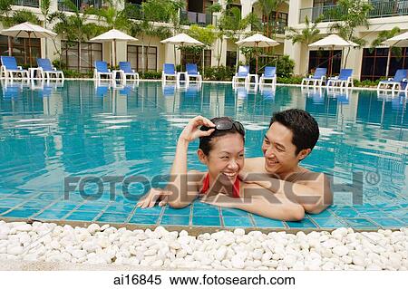 Couple in swimming pool View Large Photo Image Stock Photography - Couple in swimming pool . Fotosearch
