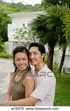 Couple looking at camera View Large Photo Image Stock Photograph - Couple looking at camera . Fotosearch