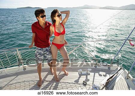 Couple on boat deck View Large Photo Image Stock Photograph - Couple on boat deck. Fotosearch