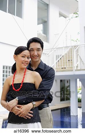 Couple smiling at camera, portrait View Large Photo Image Stock Photograph - Couple smiling at camera, portrait . Fotosearch