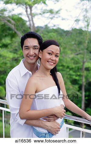 Couple smiling at camera View Large Photo Image Stock Photograph - Couple smiling at camera . Fotosearch