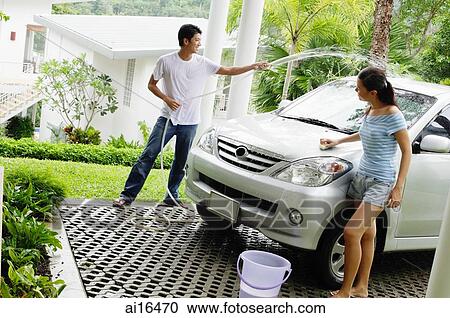 Man and woman washing car View Large Photo Image Stock Image - Man and woman washing car . Fotosearch