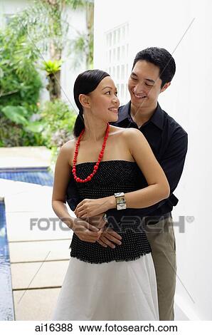 Man embracing woman View Large Photo Image Stock Photo - Man embracing woman . Fotosearch