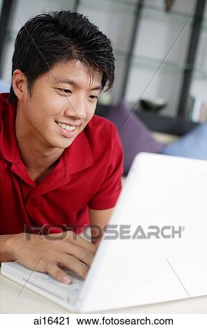 Man using laptop View Large Photo Image Stock Image - Man using laptop . Fotosearch