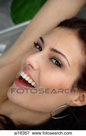 Woman looking at camera, smiling View Large Photo Image Stock Photo - Woman looking at camera, smiling . Fotosearch