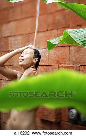 Woman taking outdoor shower View Large Photo Image Stock Image - Woman taking outdoor shower . Fotosearch