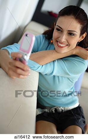 Woman using mobile phone View Large Photo Image Stock Image - Woman using mobile phone . Fotosearch
