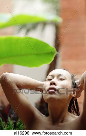 Woman with eyes closed, hands on head, taking outdoor shower View Large Photo Image Stock Photo - Woman with eyes closed, hands on head, taking outdoor shower. Fotosearch