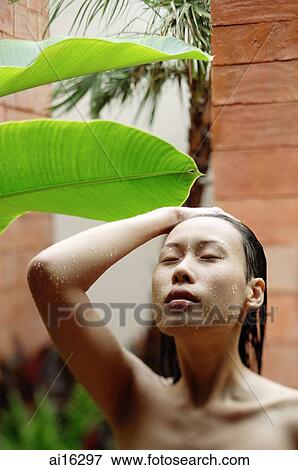 Woman with eyes closed, taking outdoor shower View Large Photo Image Stock Photo - Woman with eyes closed, taking outdoor shower . Fotosearch