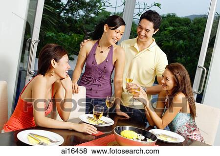Young adults having dinner party View Large Photo Image Stock Photo - Young adults having dinner party. Fotosearch
