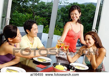 Young adults toasting with wine glasses View Large Photo Image Stock Photography - Young adults toasting with wine glasses . Fotosearch
