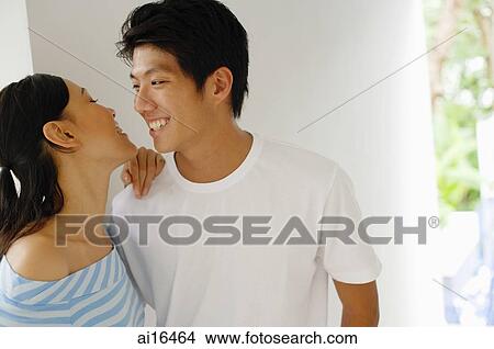 Young couple looking at each other View Large Photo Image Picture - Young couple looking at each other . Fotosearch