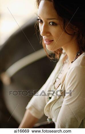 Young woman looking away, portrait View Large Photo Image Stock Photo - Young woman looking away, portrait . Fotosearch
